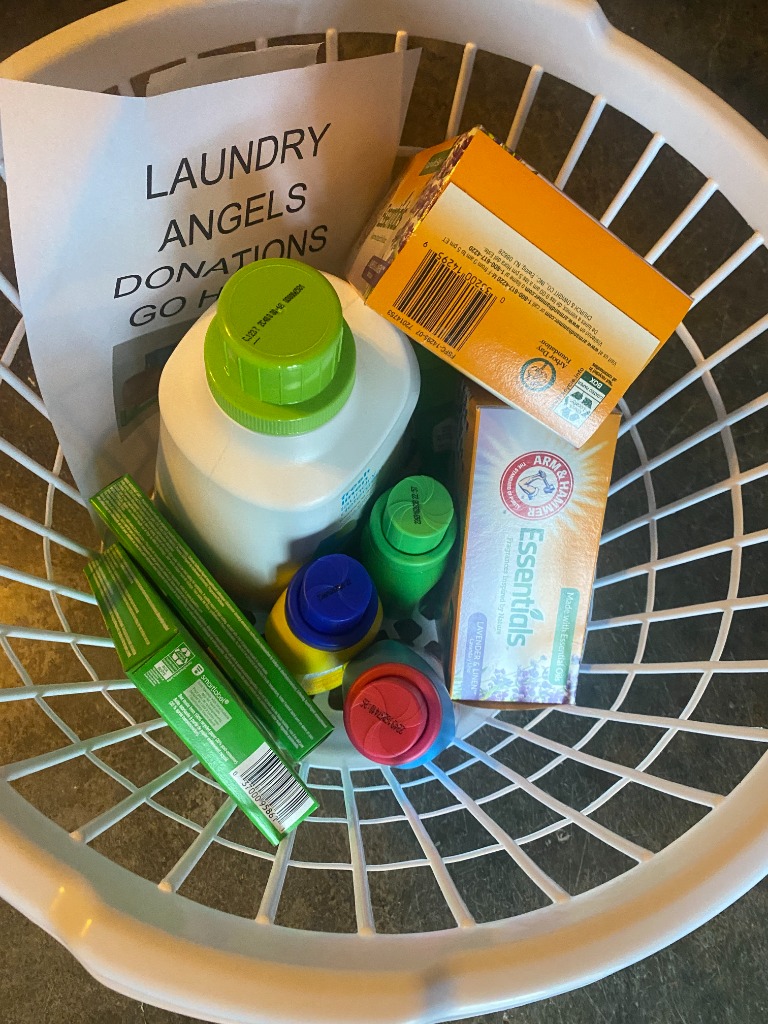 Donated laundry supplies including detergent and baskets